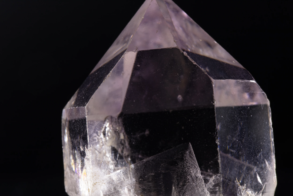 Macro photograph of a zoned purple amethyst crystal termination from Brazil.