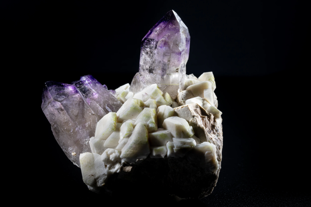Deep purple amethyst crystals on cream colored feldspar from Namibia.
