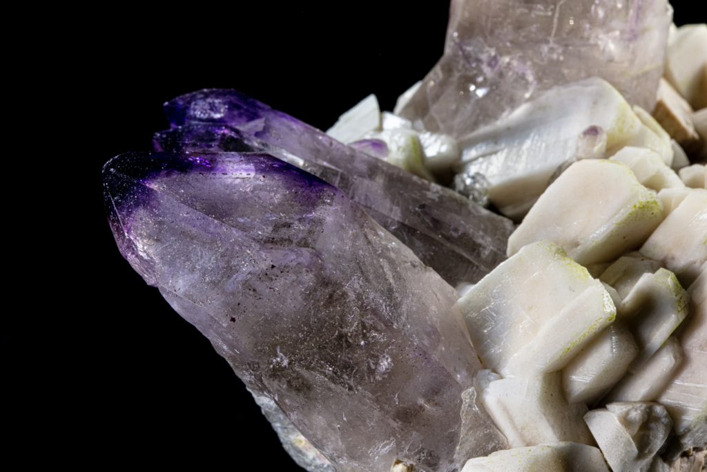 Detailed view of secondary amethyst crystals on white matrix from Namibia.