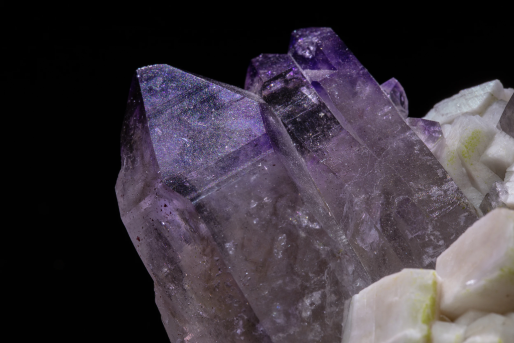 Extreme macro of skeletal amethyst crystal faces showing structural growth lines.