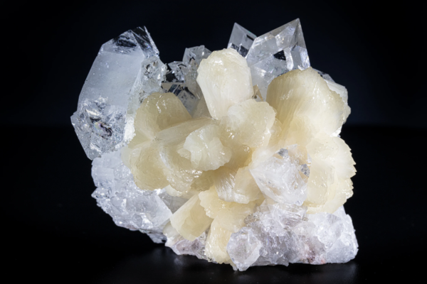 Clear apophyllite crystals with pyramidal terminations from India.