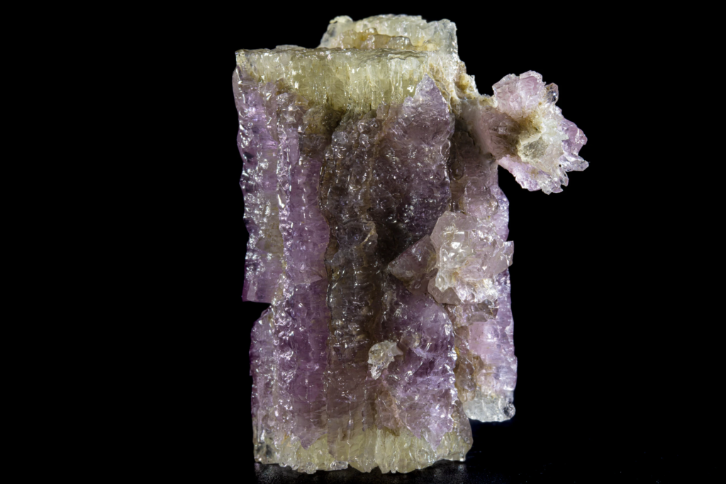 Close-up of a purple pseudohexagonal twin aragonite specimen from Spain.