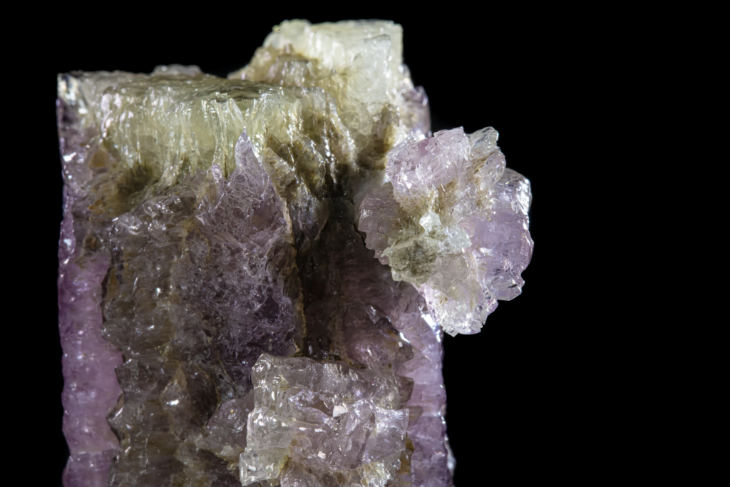 Macro photograph of a branching purple aragonite twin cluster from Spain.