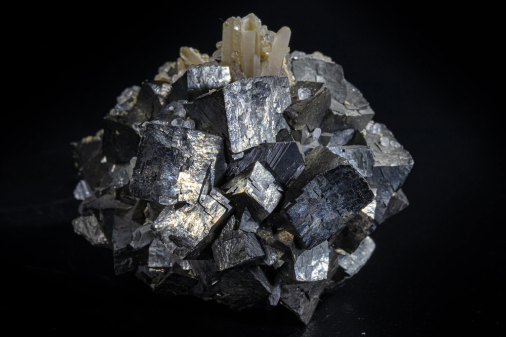Granular quartz and calcite aggregates on metallic gray arsenopyrite, Kosovo.