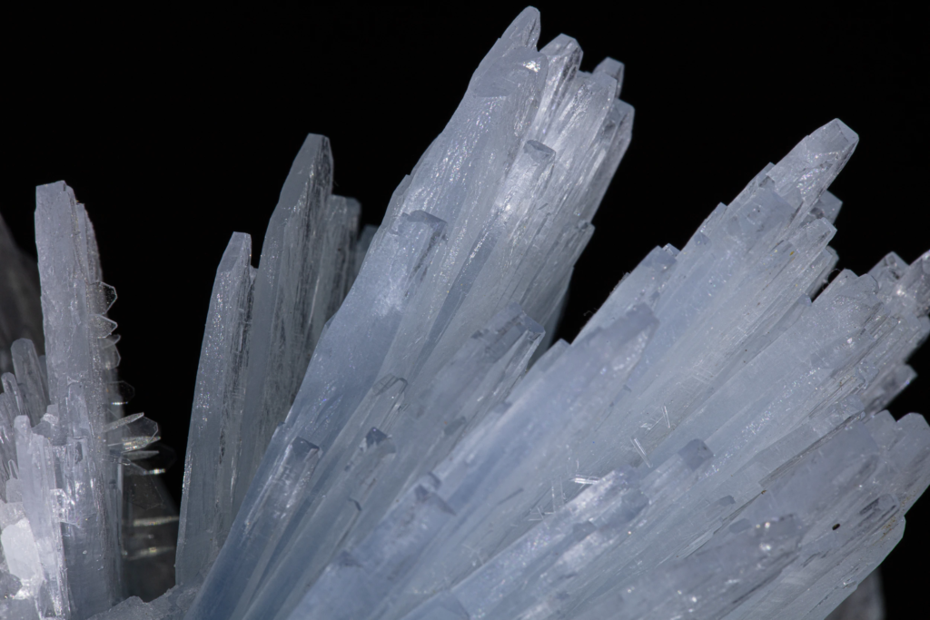 Macro detail of sharp pale blue barite terminations from Morocco.
