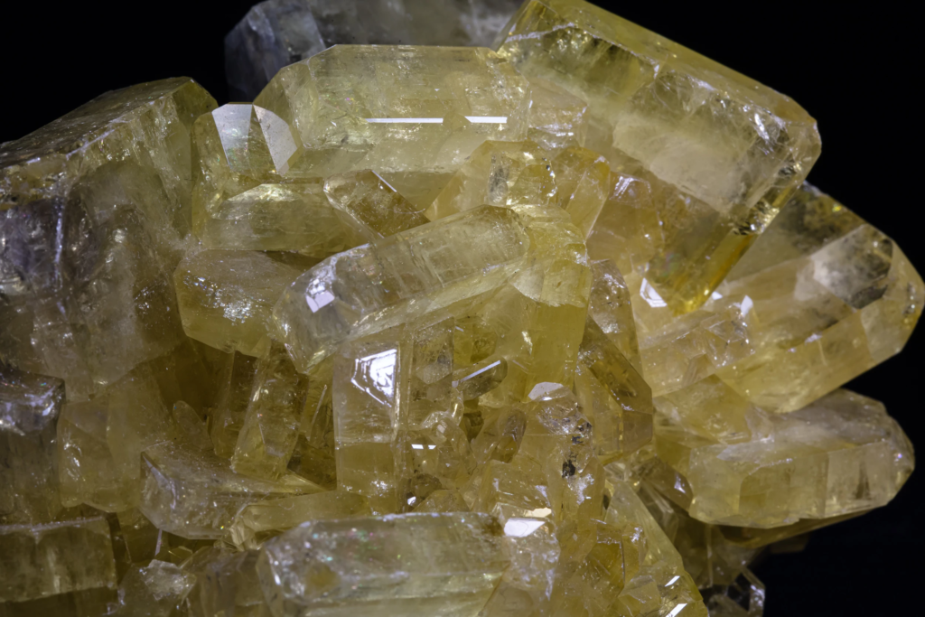 Detailed view of intersecting translucent yellow barite crystal blades from USA.