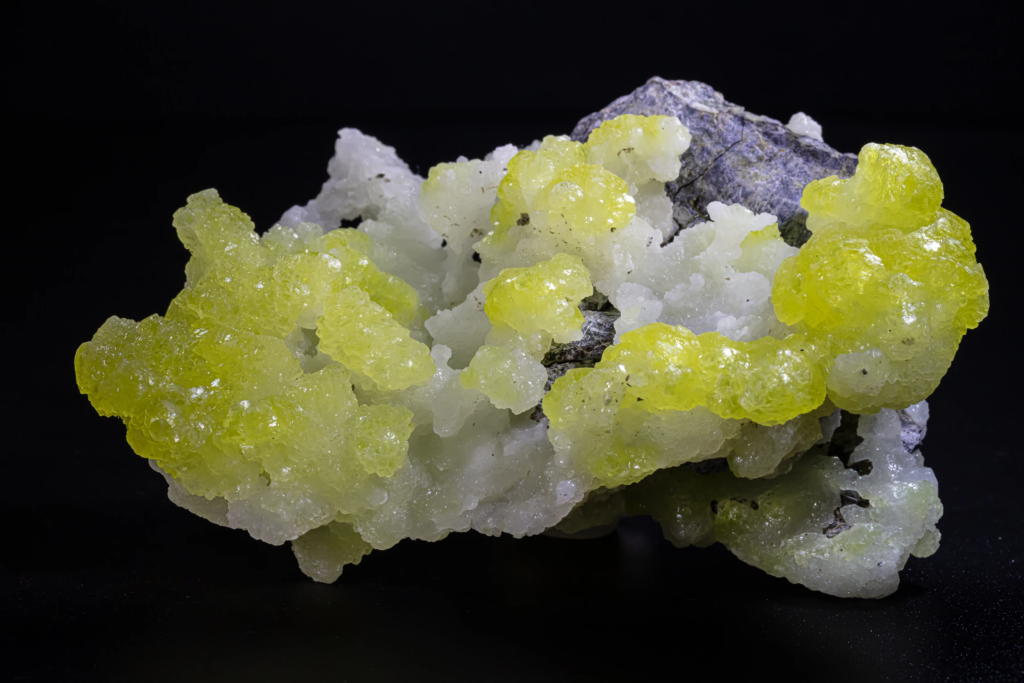 Bright yellow botryoidal brucite cluster on white matrix from Pakistan.