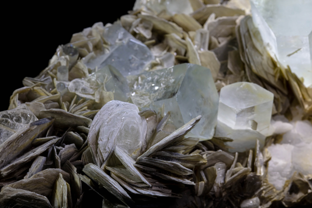 Full pale blue aquamarine and muscovite specimen from Pakistan with reflection.