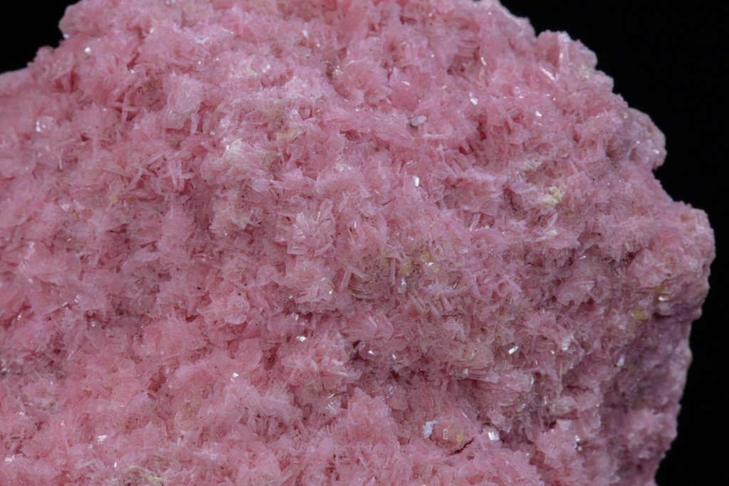Macro photograph of translucent brown axinite blades from Peru.