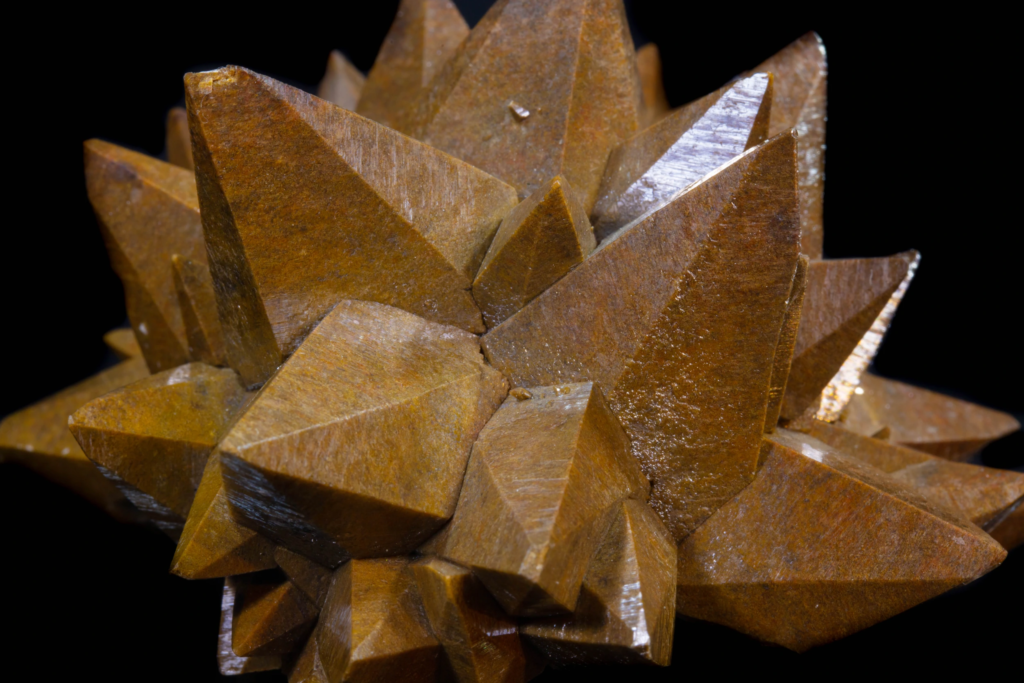 Close-up of interlocking brown acute calcite crystal points, Mexico.