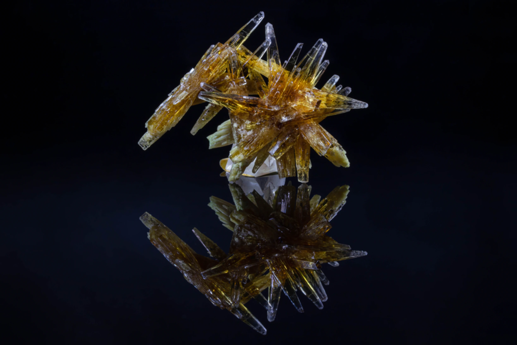 Honey yellow prismatic celestine crystal cluster from Poland with reflection.