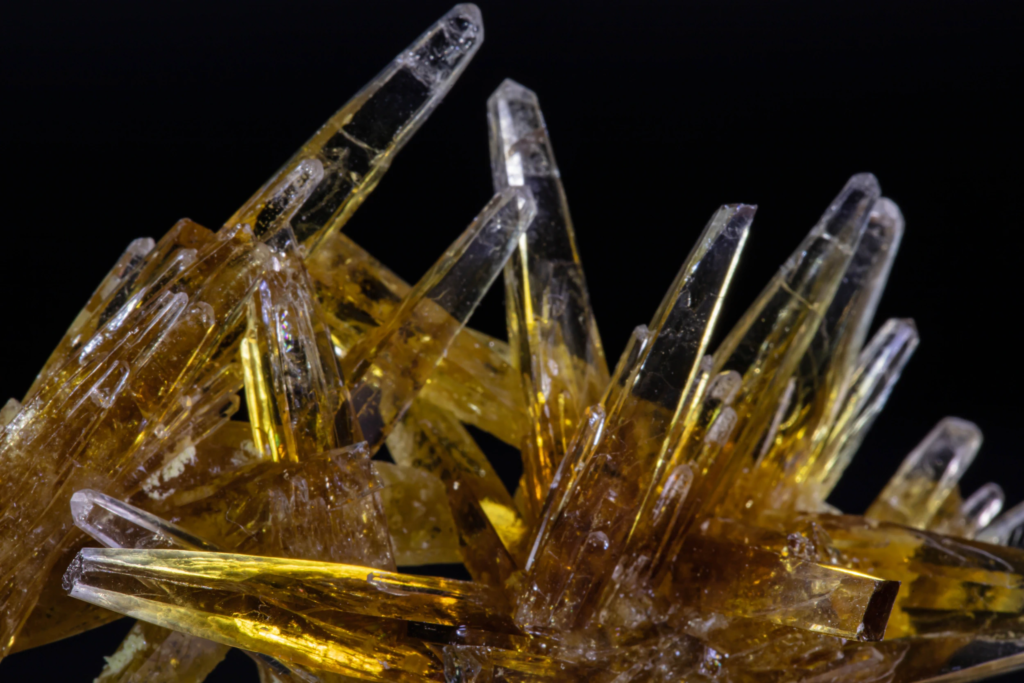 Macro photograph of clear colorless tips on honey yellow celestine crystals.