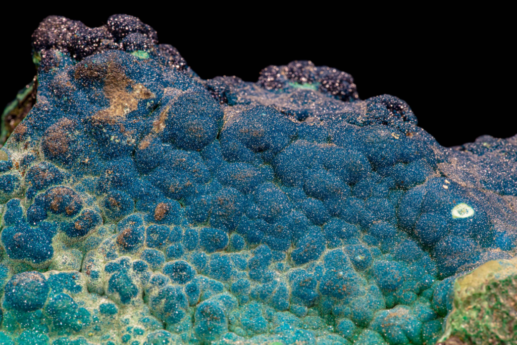 Full cornetite mineral specimen from Congo with mirror reflection.