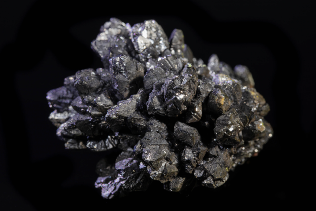 Detailed horizontal overview of a black descloizite crystal aggregate.