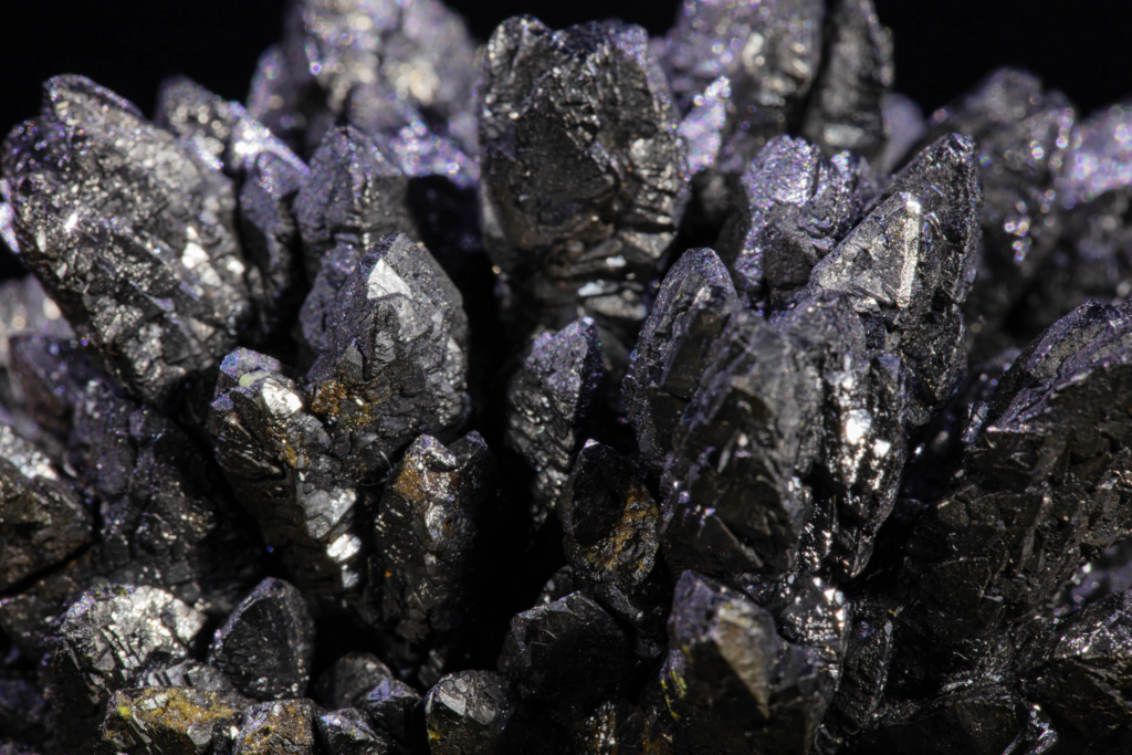 Close macro view of sharp pointed black descloizite crystal terminations.