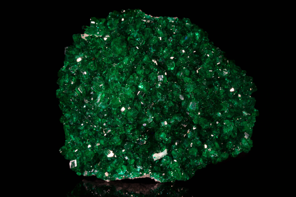 Close front overview of a dense green dioptase crystal aggregate